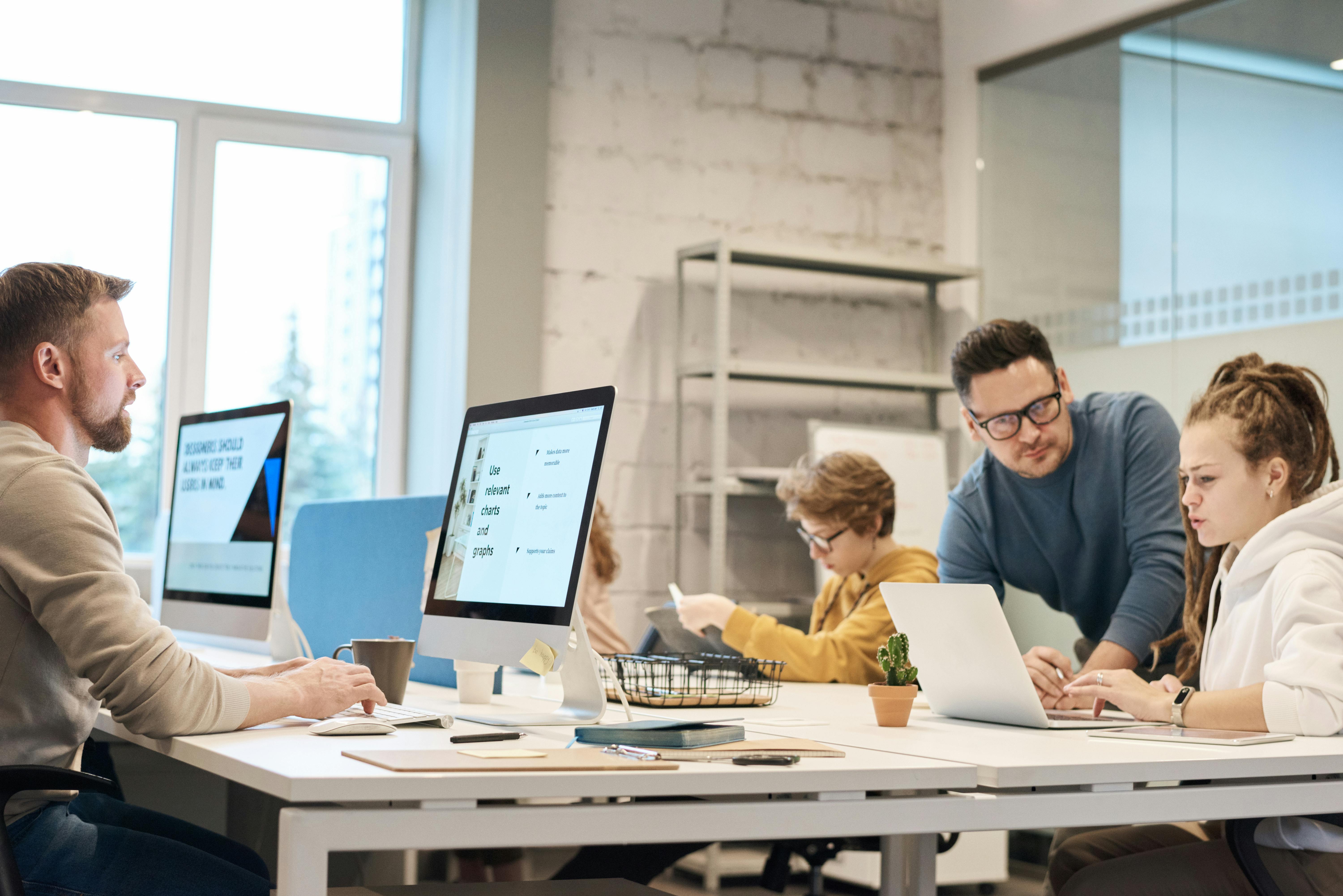 a group of people working on computers