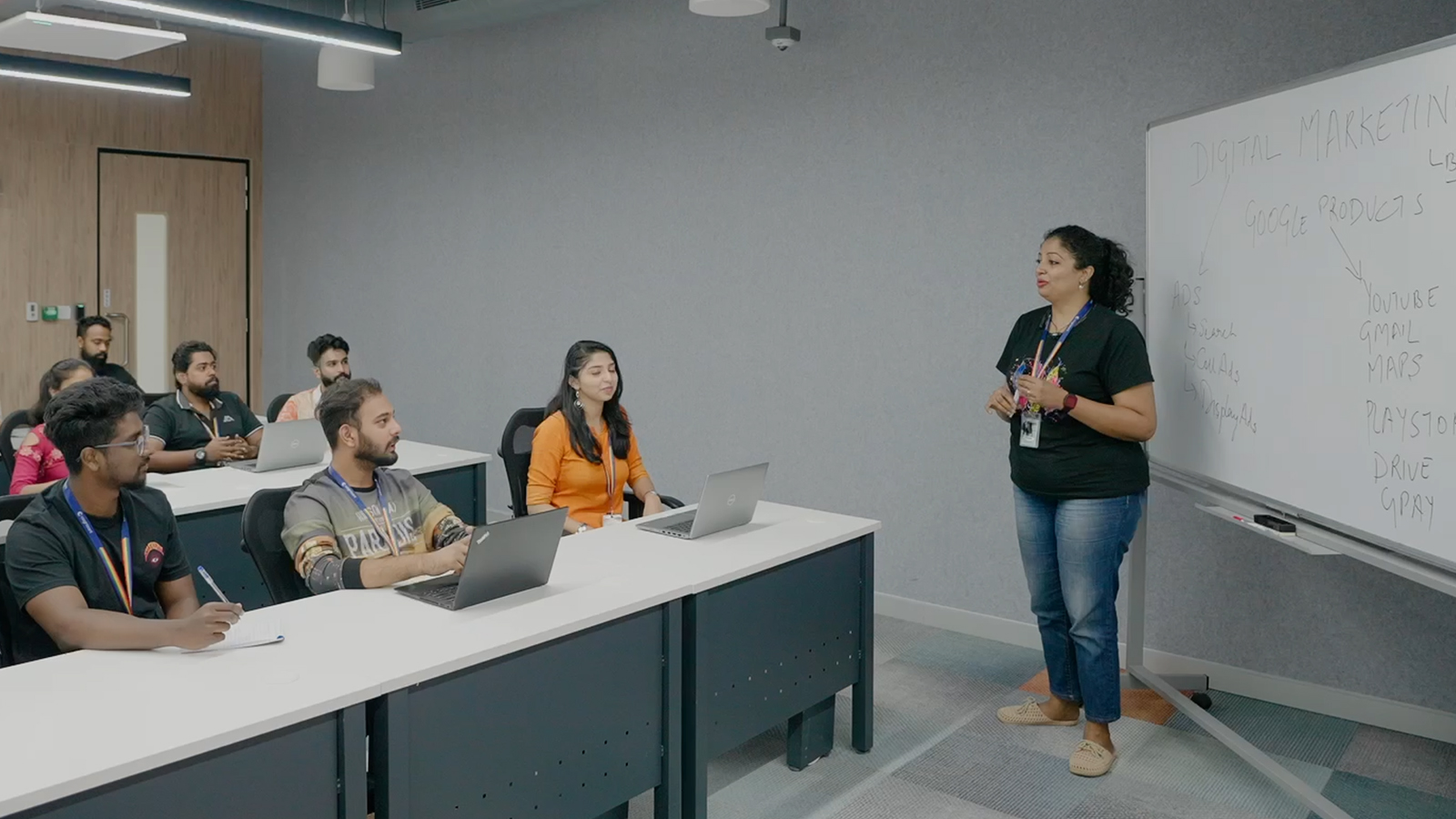 a person standing in front of a group of people