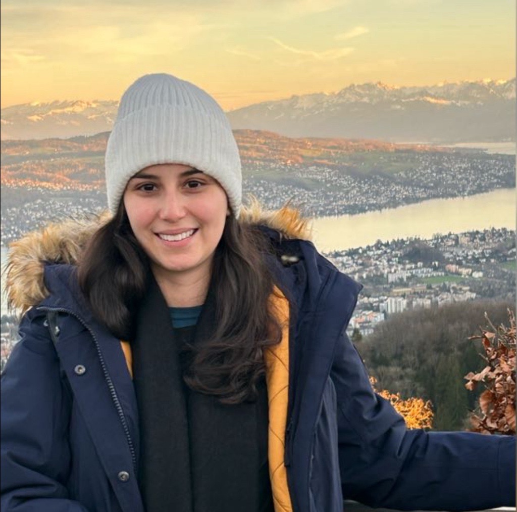 a person in a hat and coat