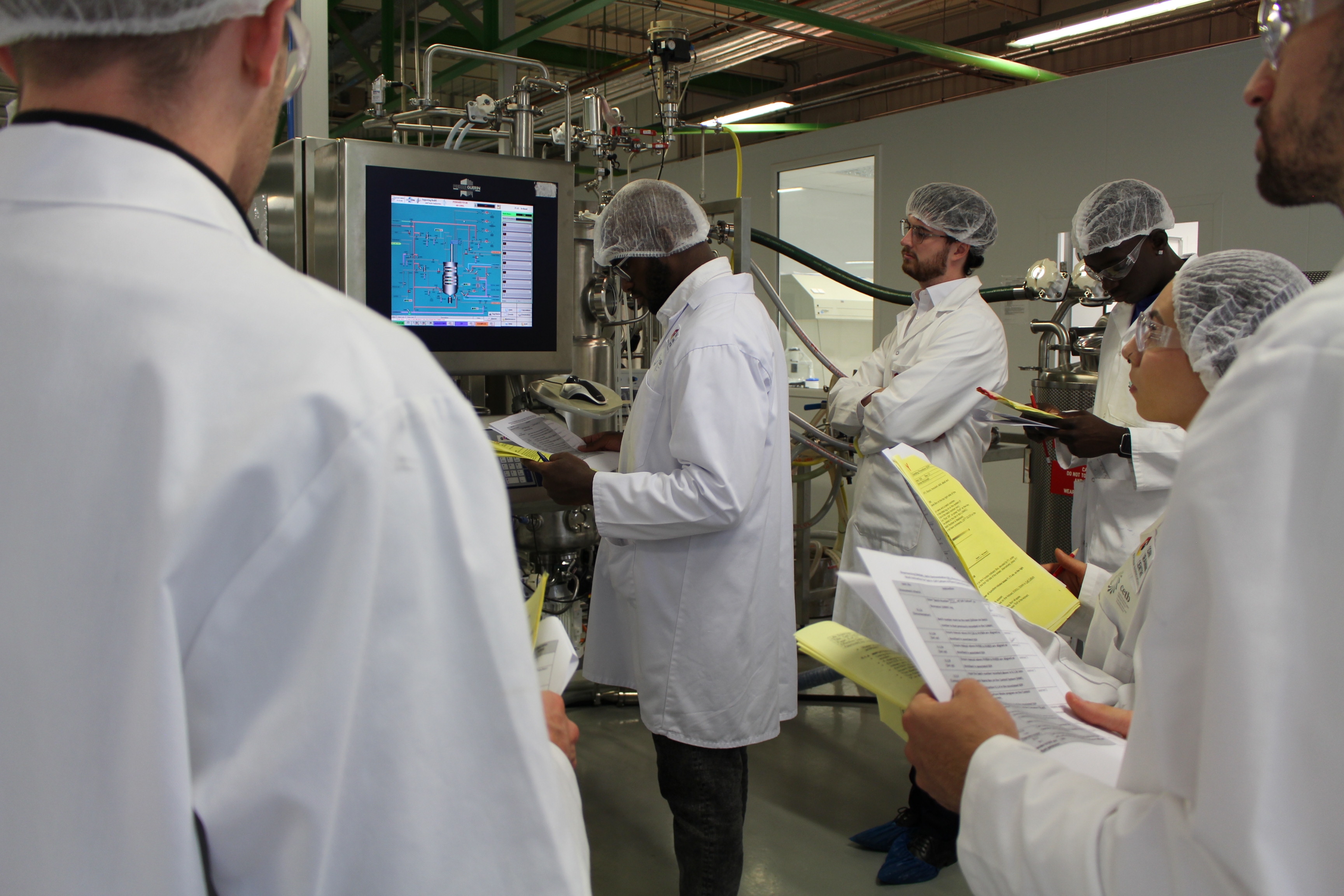 a group of people in white coats