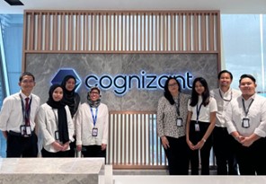 a group of people standing in front of a sign