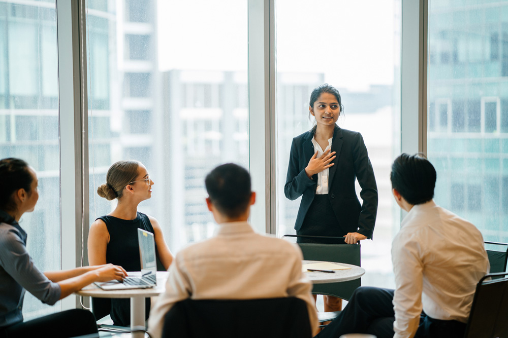 a person standing in front of a group of people