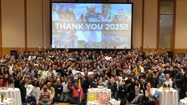 a large group of people posing for a photo