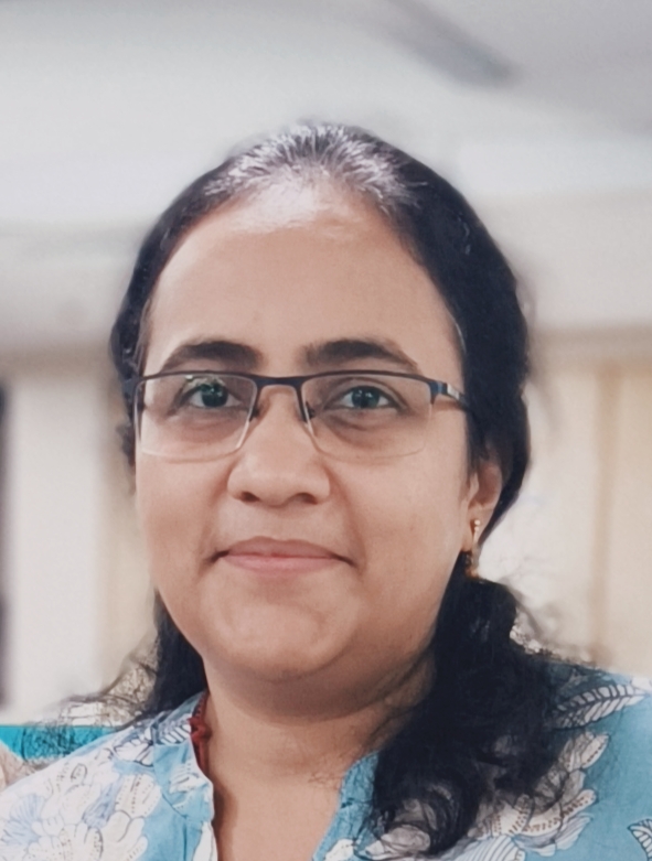 a person with glasses smiling