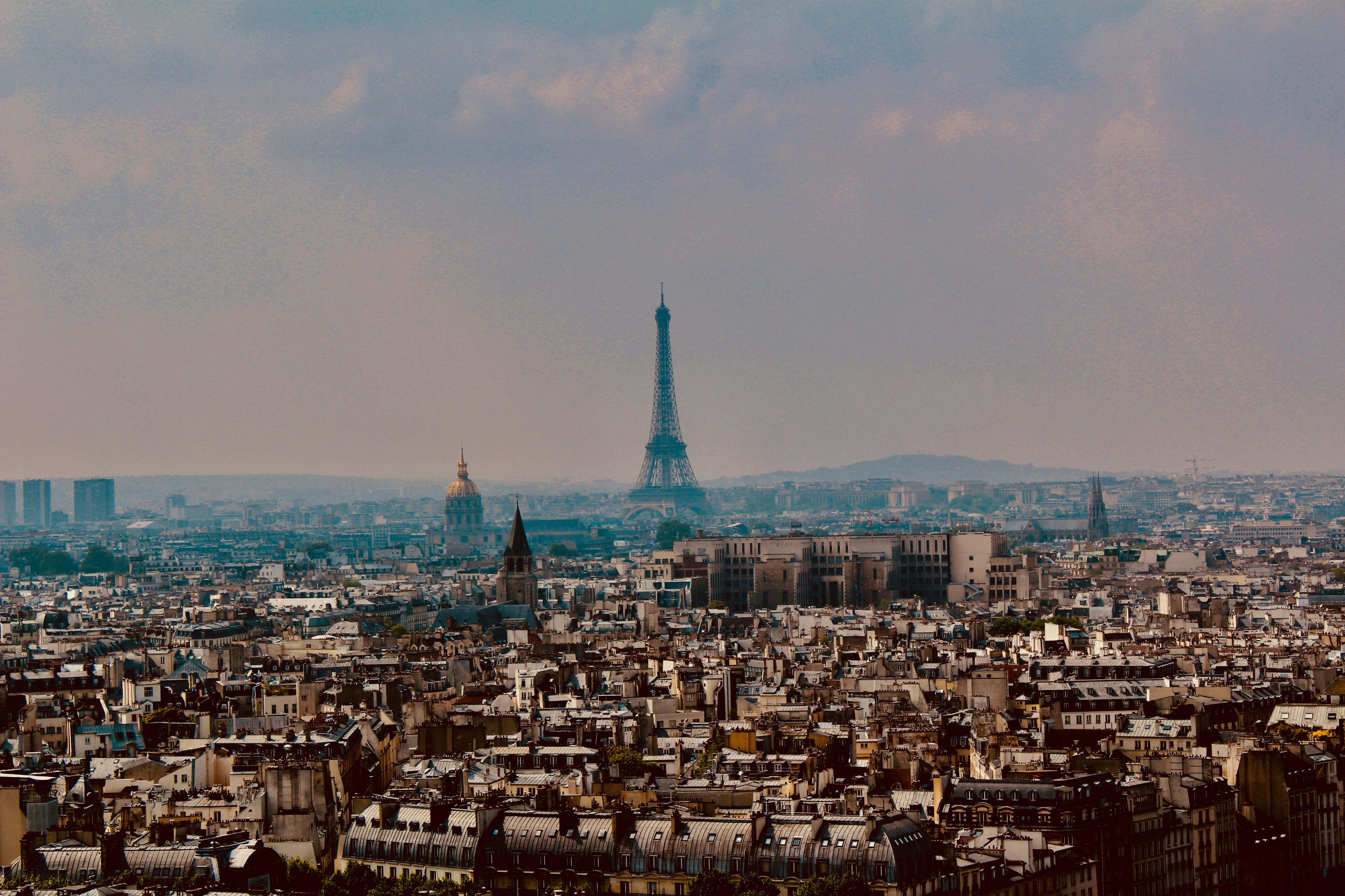 a city with a tall tower in the distance