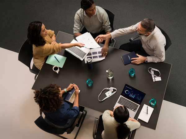 a group of people sitting around a table