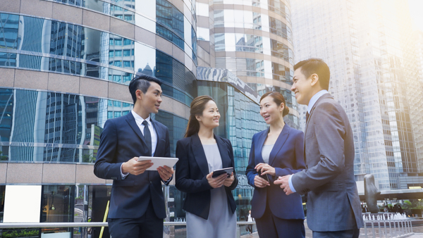 a group of people standing outside a building