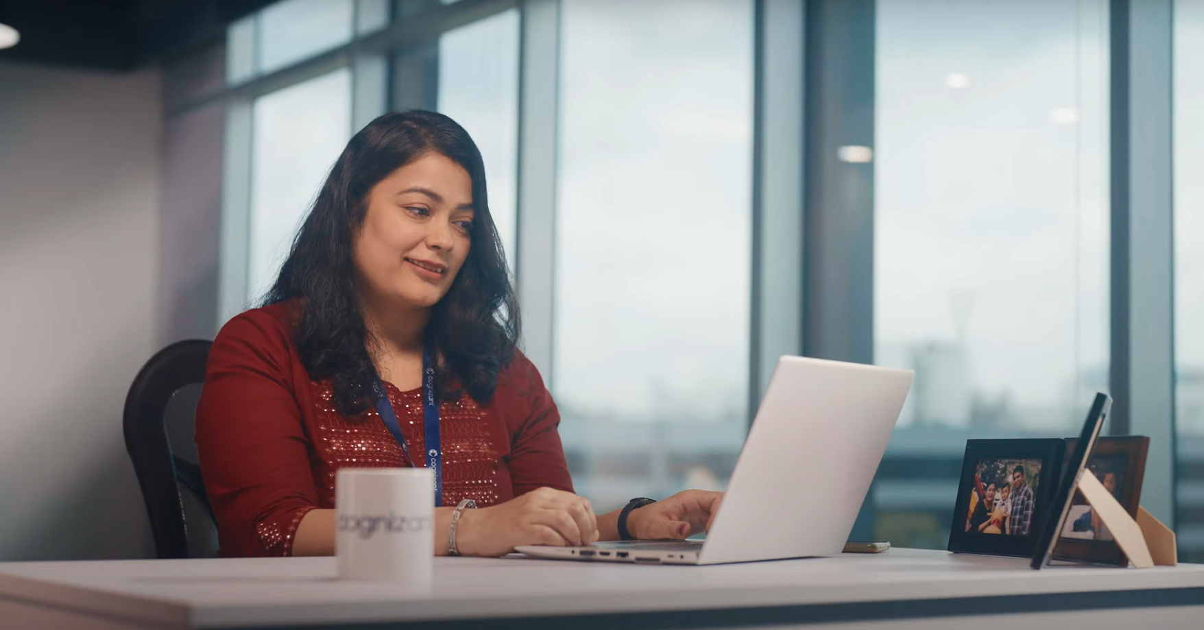 a person sitting at a desk with a laptop